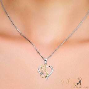 heart cat necklace in silver and gold worn around neck 4131000