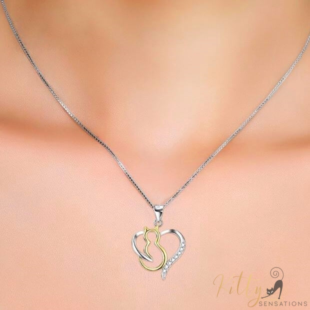 heart cat necklace in silver and gold worn around neck 4131000