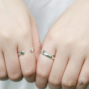 2 flexible silver cat rings with tiny ears and paws worn on 2 human hands 1733147-resizable-gszr0064