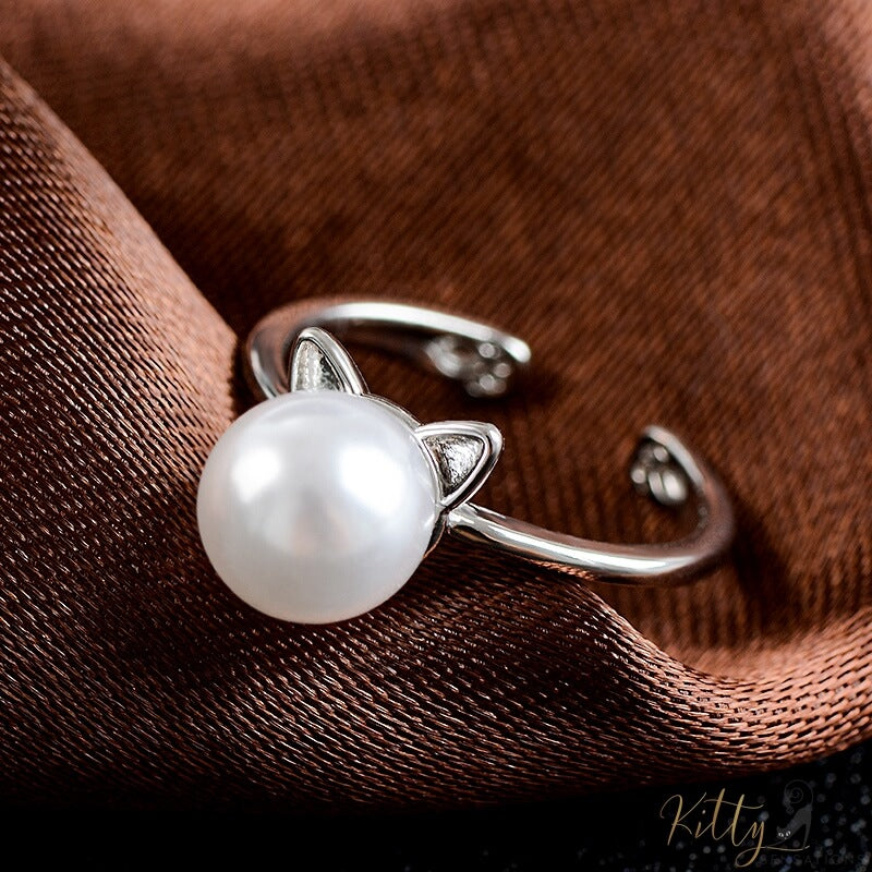 cute silver pearl cat ring with little paws on brown fabric 15731344-ring