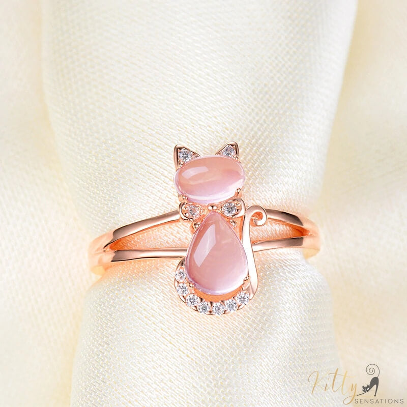 opal cat ring in 14k rose gold on cloth