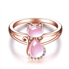 opal cat ring in 14k rose gold on white ground